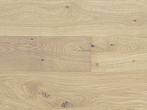 Light-toned wood flooring with visible grain and knots.