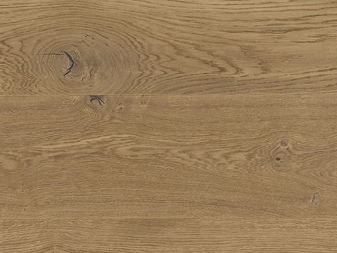 Close-up of light brown wood grain with knots and swirling patterns.