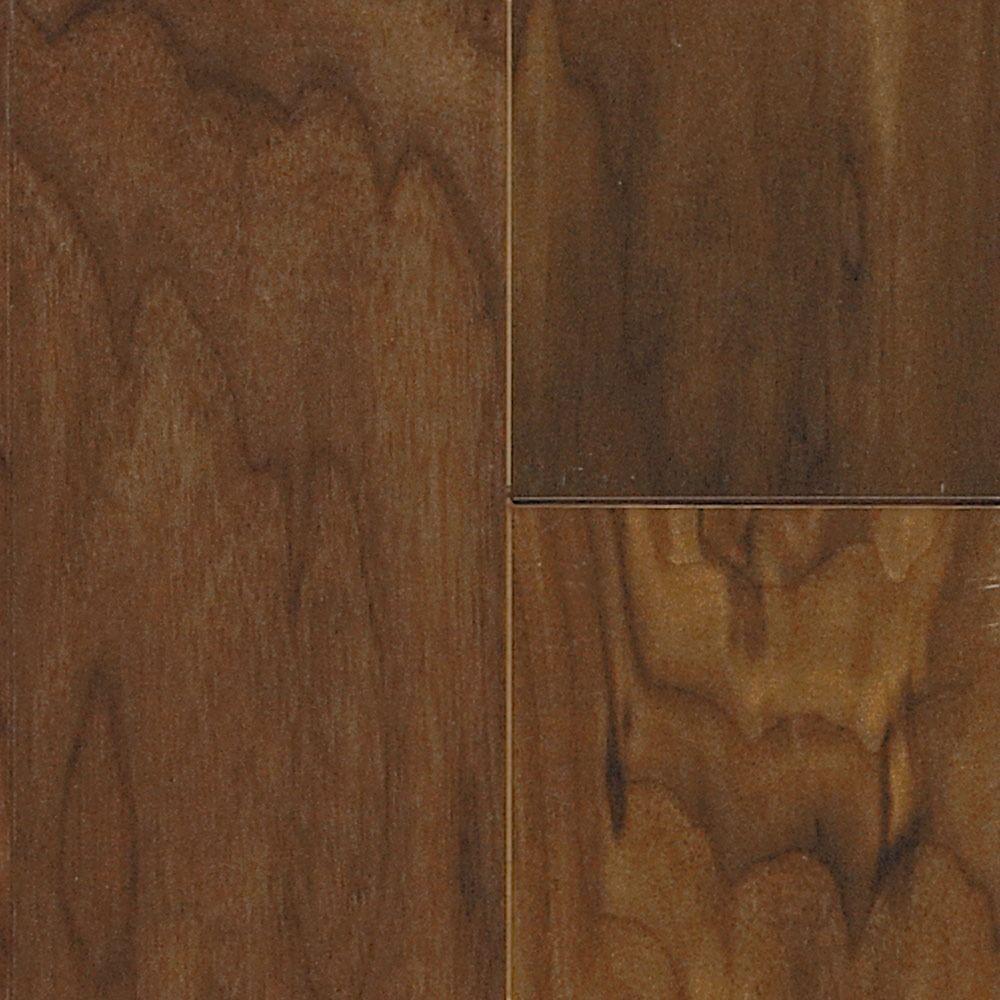 Close-up of wooden floorboards in shades of brown with visible grain patterns.