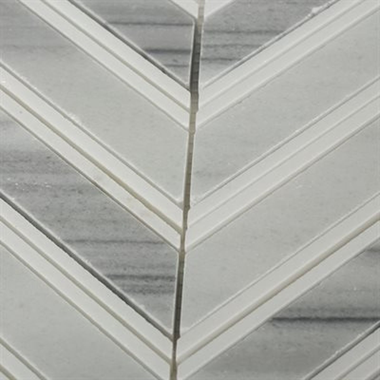 Chevron pattern tile in shades of gray and white, with thin raised border lines.