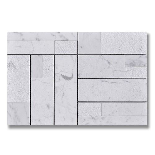White marble tile mosaic with various rectangular and textured shapes.