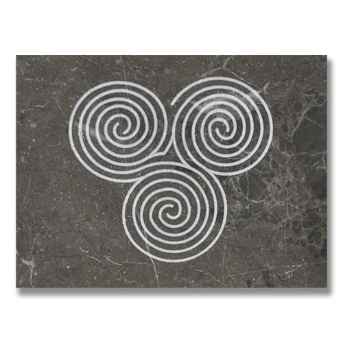 White Triskele spiral symbol on a dark gray marble background.