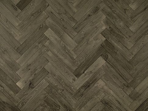 Herringbone pattern wooden floor in shades of brown and gray.