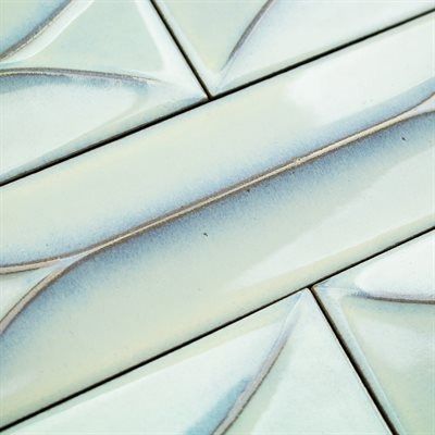 Light blue and white ceramic tiles arranged in a diagonal pattern.