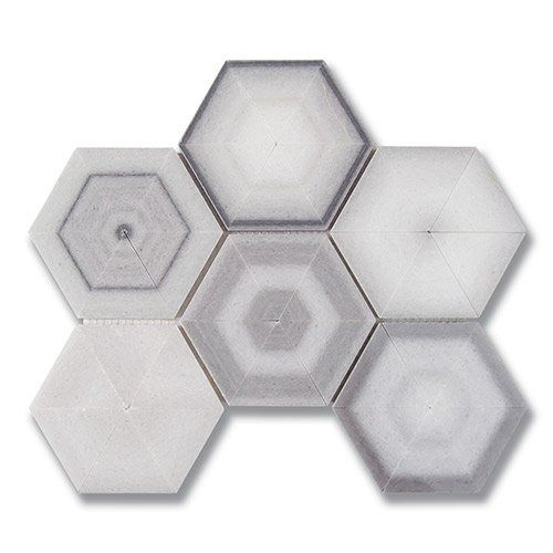 Seven hexagonal tiles arranged in a shape. Tiles gradient from white to gray, with concentric patterns.