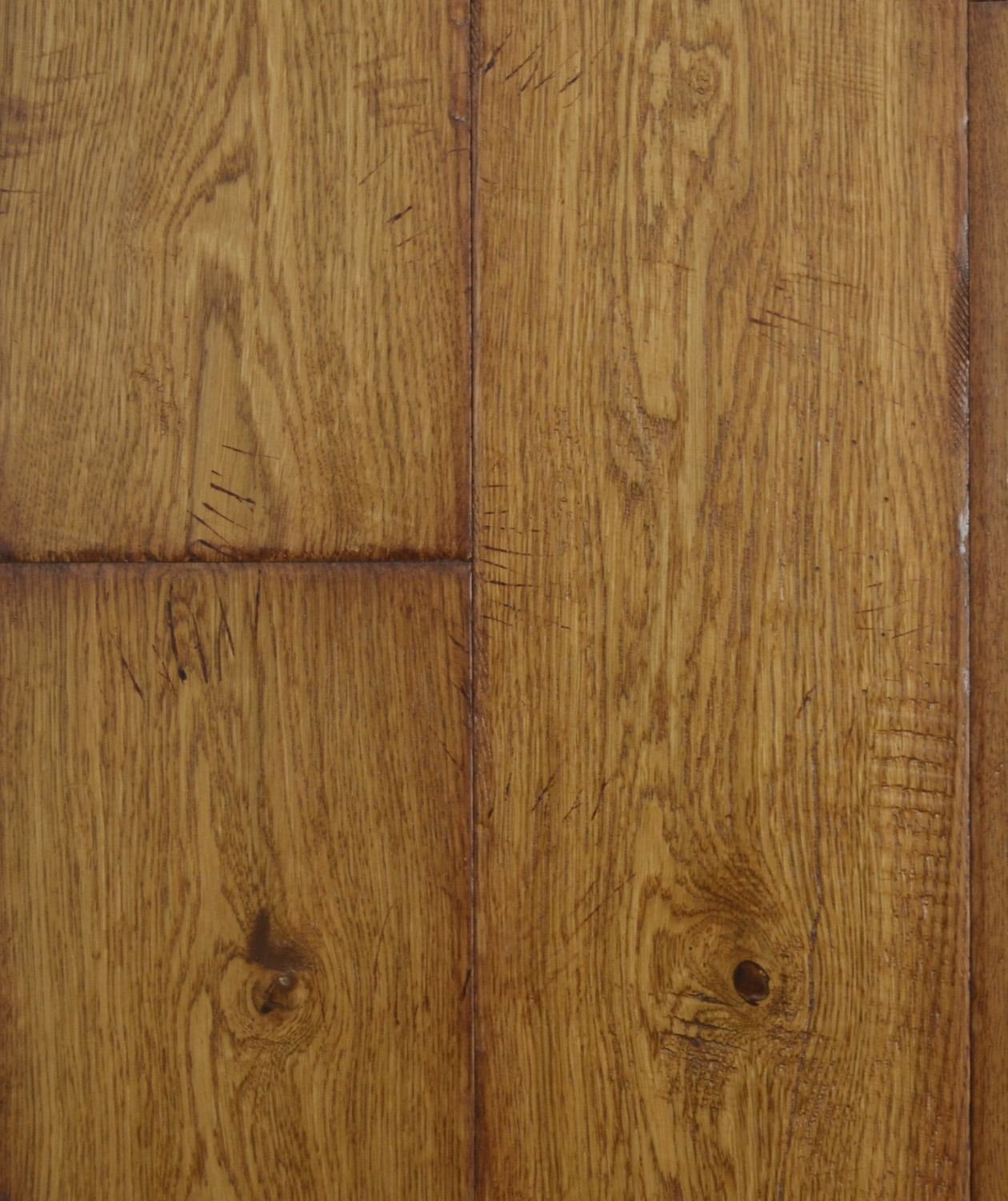 Close-up of brown wood flooring with visible grain and knots.