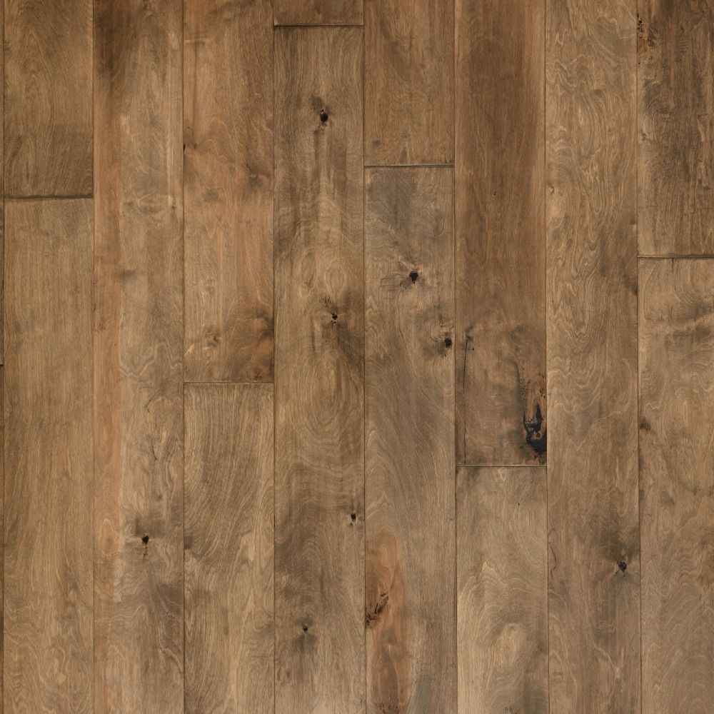 Wooden flooring with varying shades of brown and natural wood grain details.