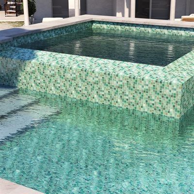 Square pool with turquoise water and mosaic tile walls.