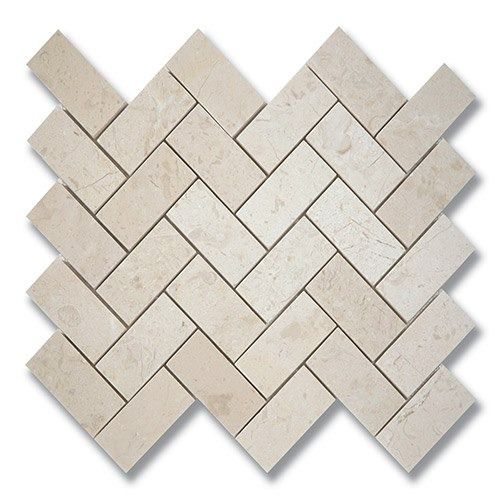 Beige rectangular tiles in a herringbone pattern.