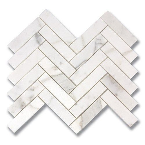White marble herringbone tile pattern.
