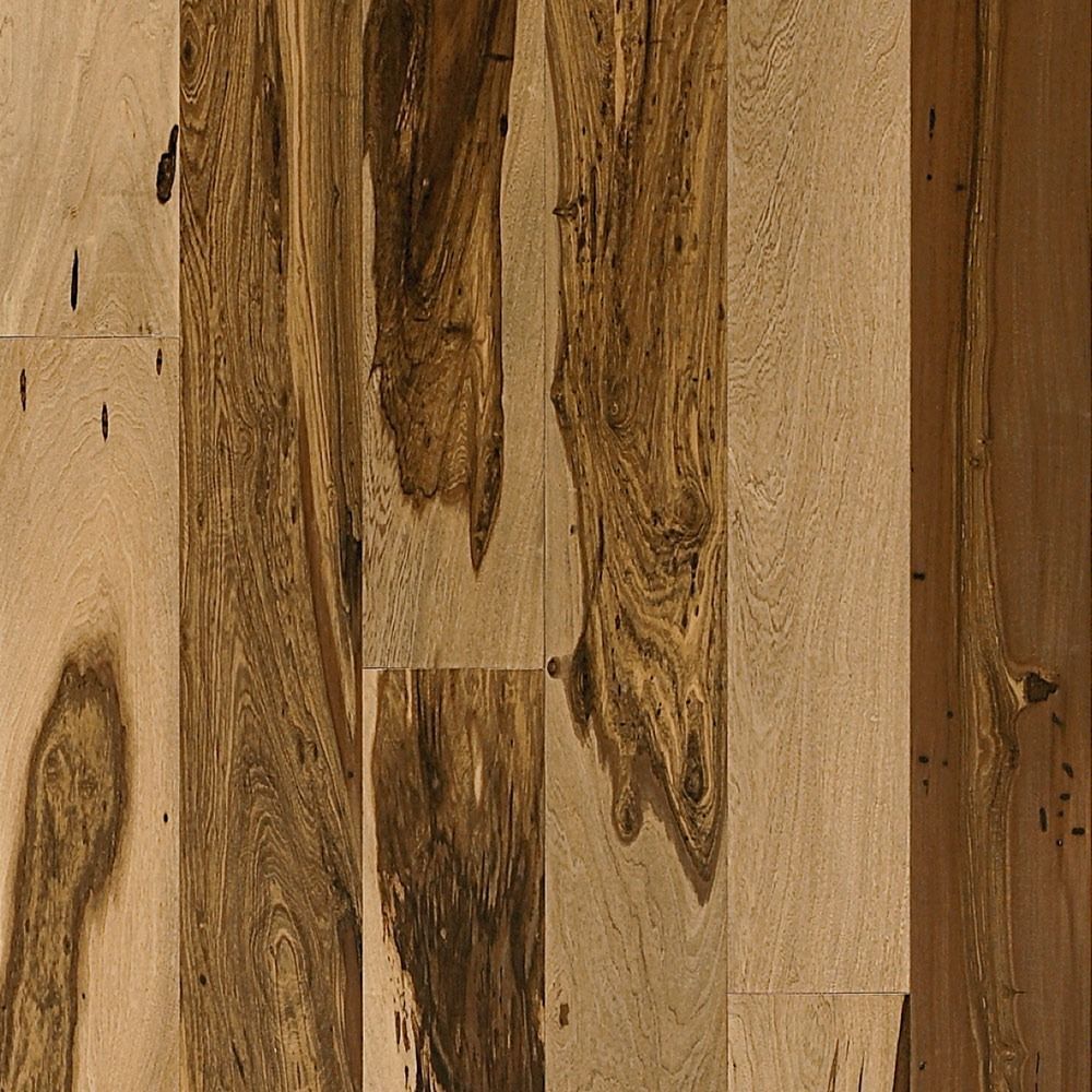 Wood flooring with a natural, varied grain pattern in shades of brown and tan.