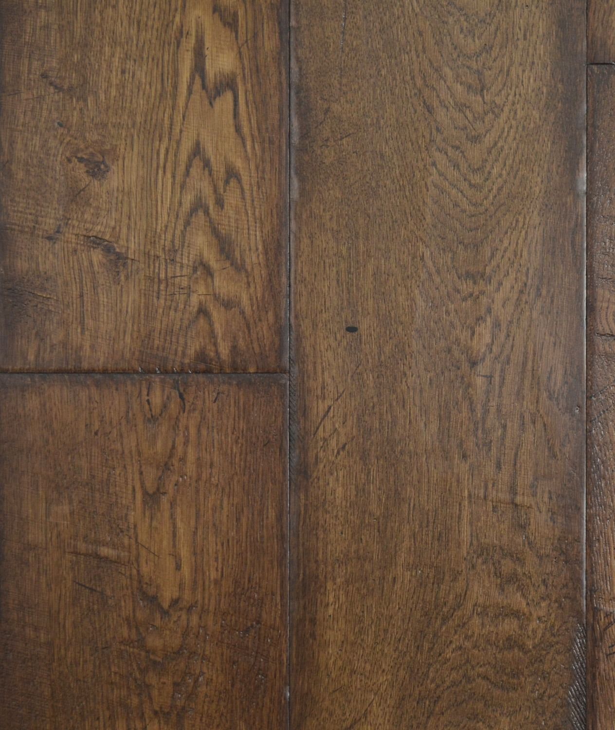 Close-up of dark brown hardwood flooring with visible wood grain and knots.