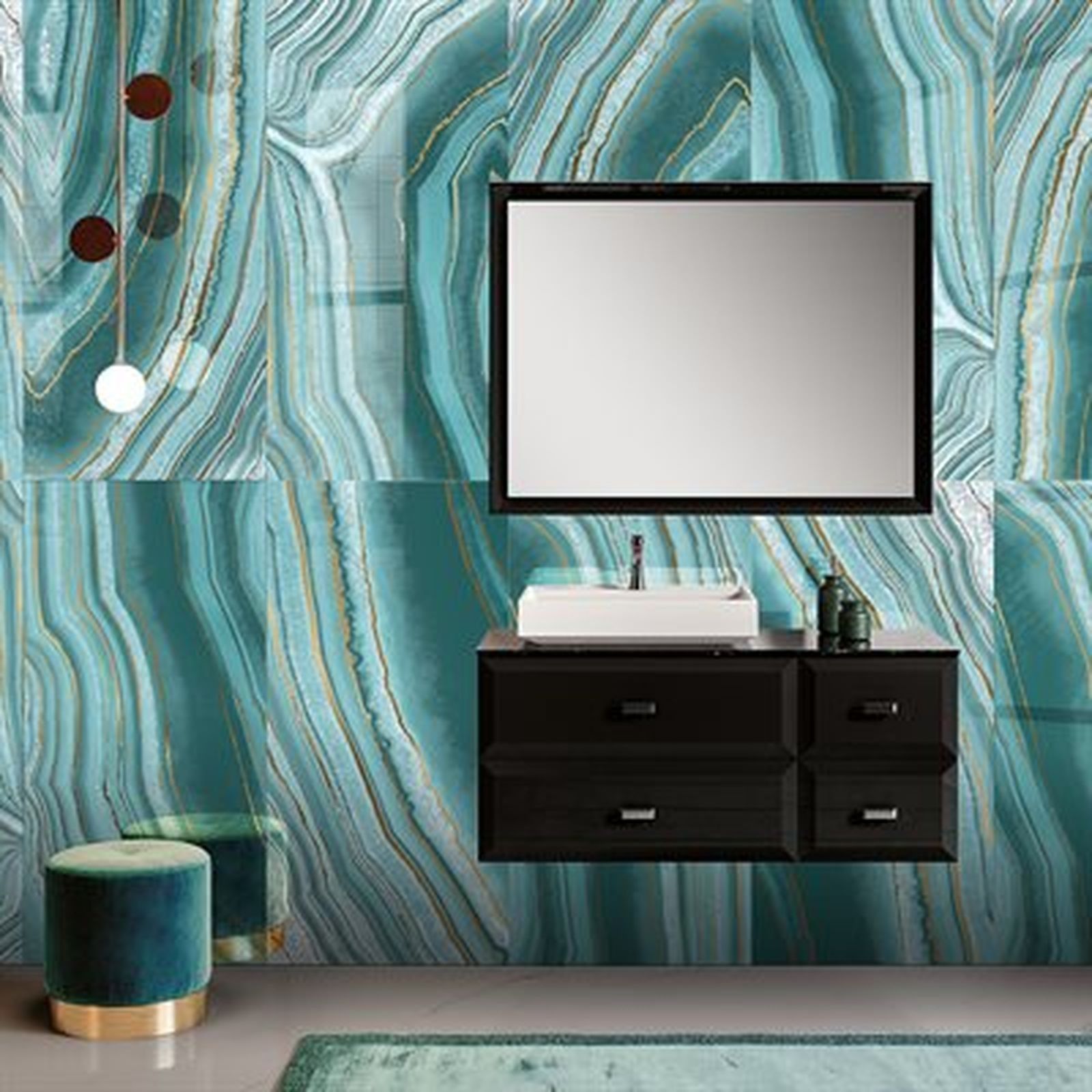 Bathroom with turquoise agate-style tiled wall, black vanity, large mirror, and a small stool.