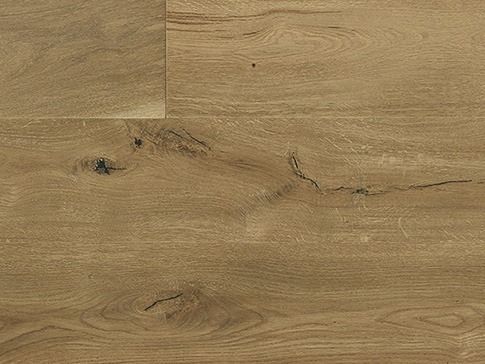 Close-up of light brown wood flooring with visible grain and knots.