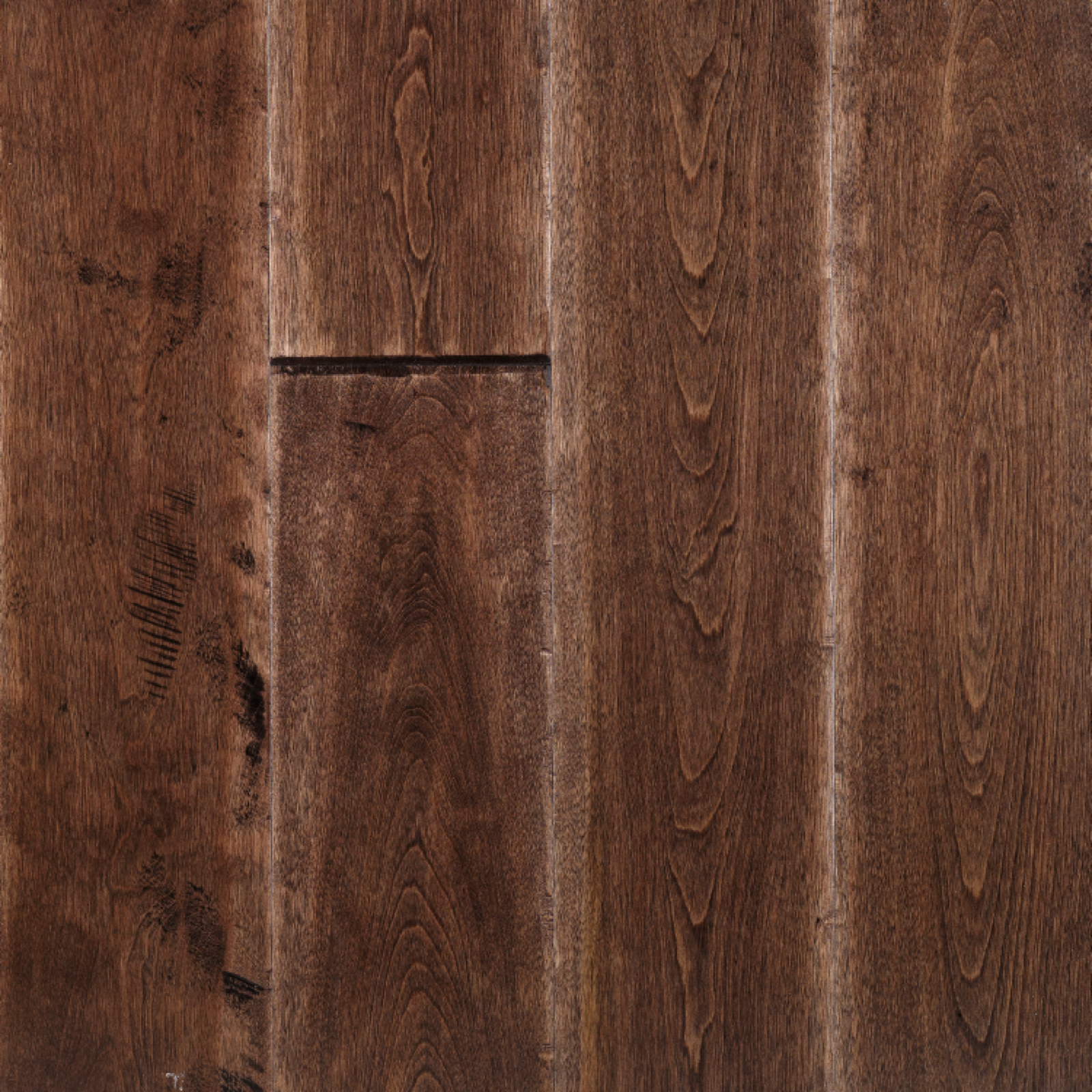 Close-up of brown hardwood flooring with visible wood grain and knots.