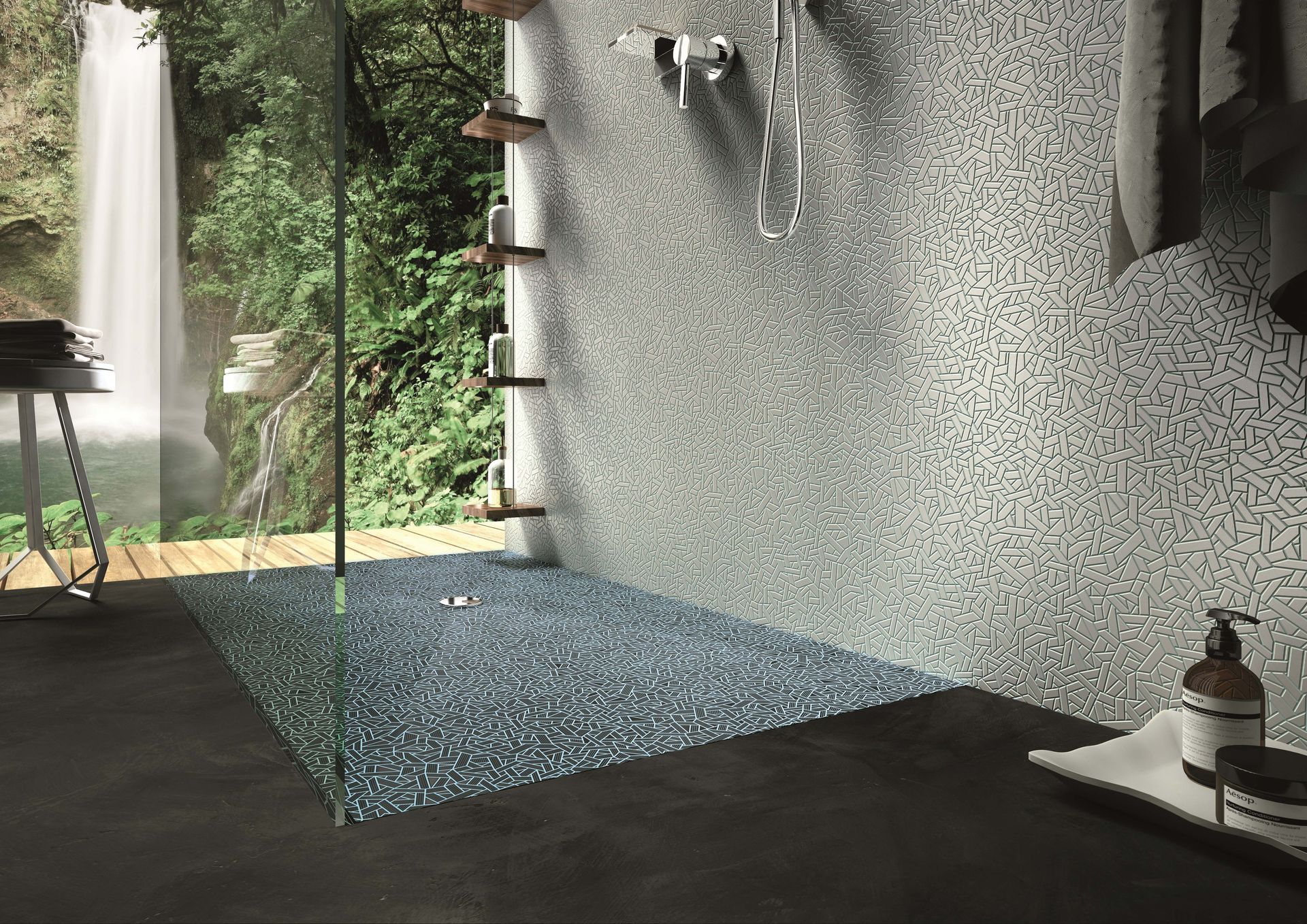 Shower with waterfall scene and pebble-like mosaic tiles.