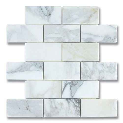 White marble subway tile mosaic with gray veining.