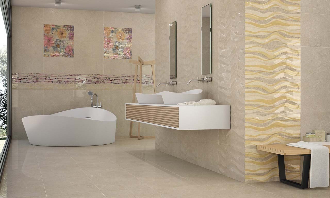 Modern beige bathroom with a white tub, floating sink, and decorative tile.