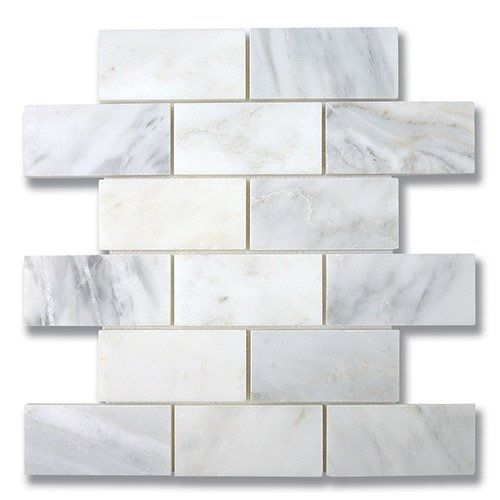 White marble subway tile, stacked brick-style pattern.