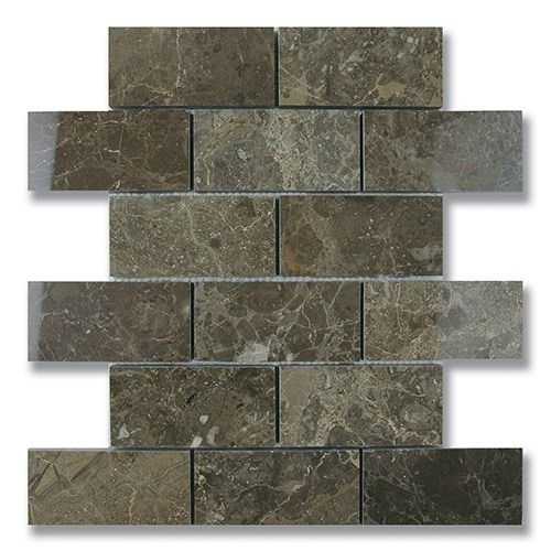 Close-up of rectangular, dark brown marble tiles in a brick pattern, with variations in color and veining.