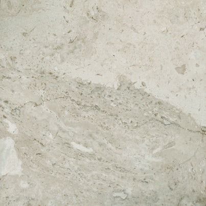 Light gray and tan marble stone tile with swirling patterns and specks.