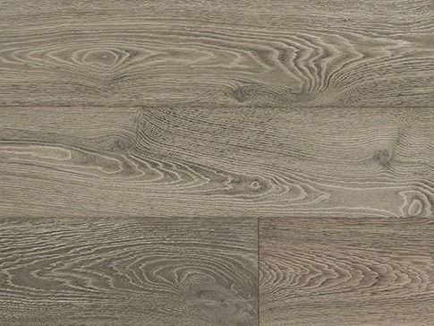 Close-up of gray-toned wood flooring with visible grain patterns and knots.