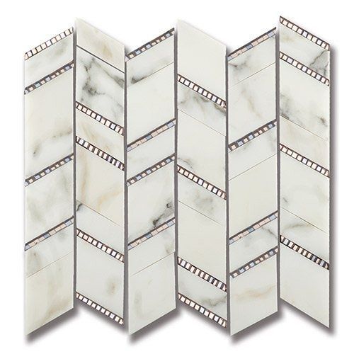 Zigzag pattern marble tiles with copper-colored accent trim.