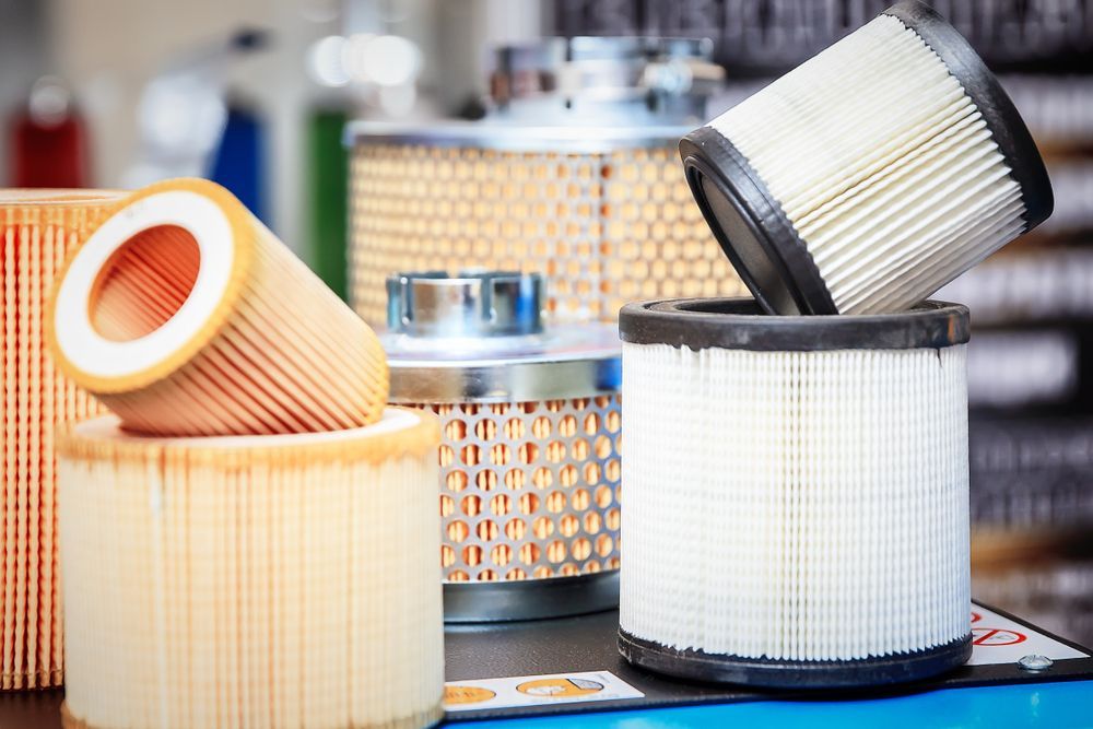 A Group of Air Filters Are Stacked on Top of Each Other on A Table — Top End Diesel In Wishart, NT
