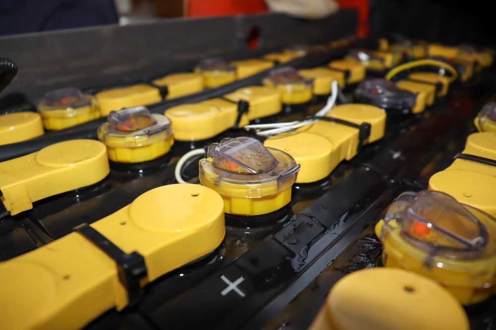 A Bunch of Yellow Batteries with A Cross on Them — Top End Diesel In Alice Springs, NT
