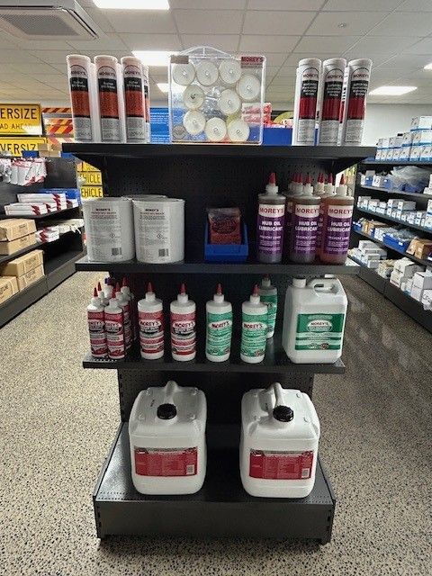 A Person Is Pouring Oil Into a Car Engine — Top End Diesel In Wishart, NT
