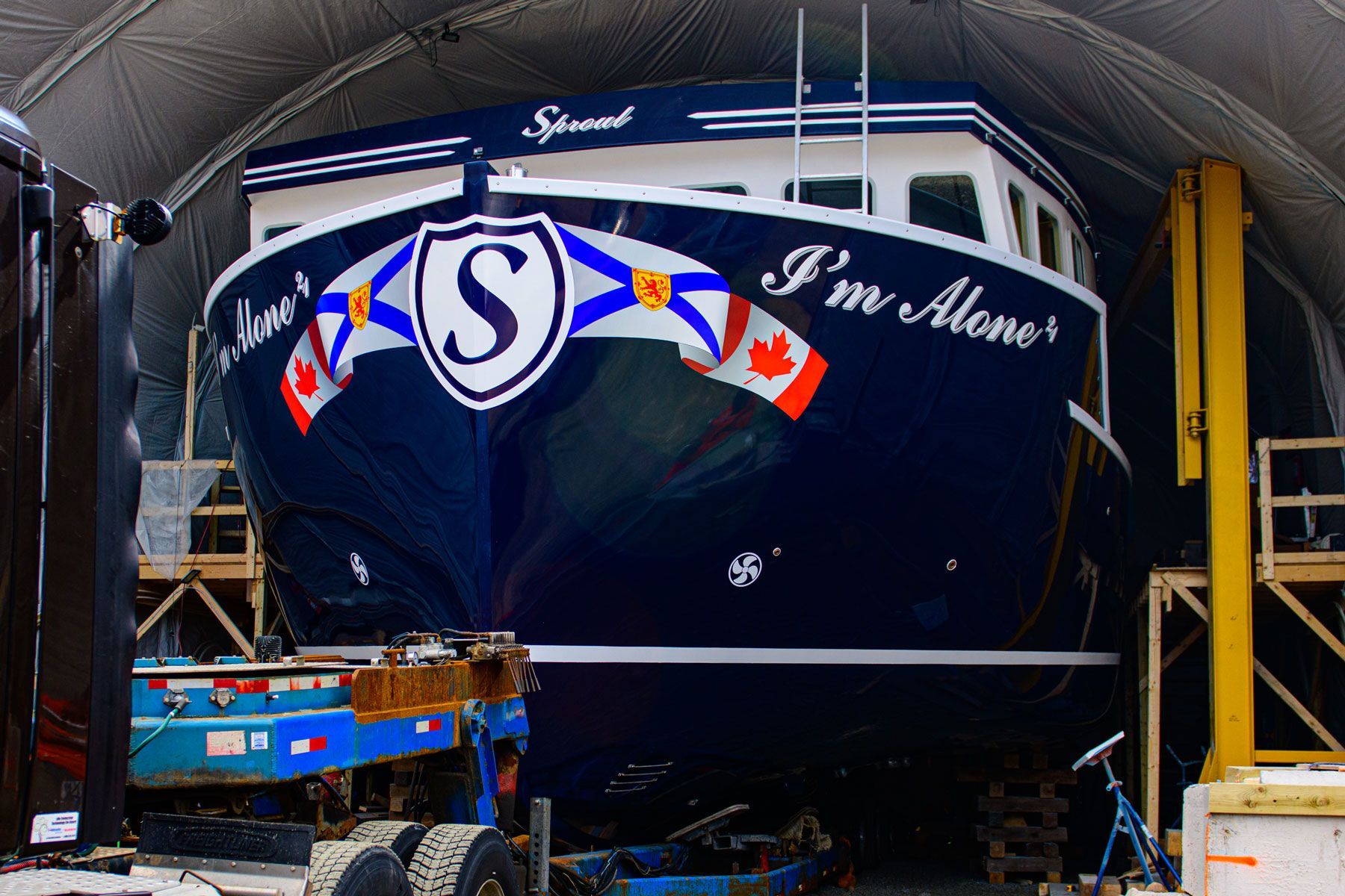 A boat that says i 'm alone on it