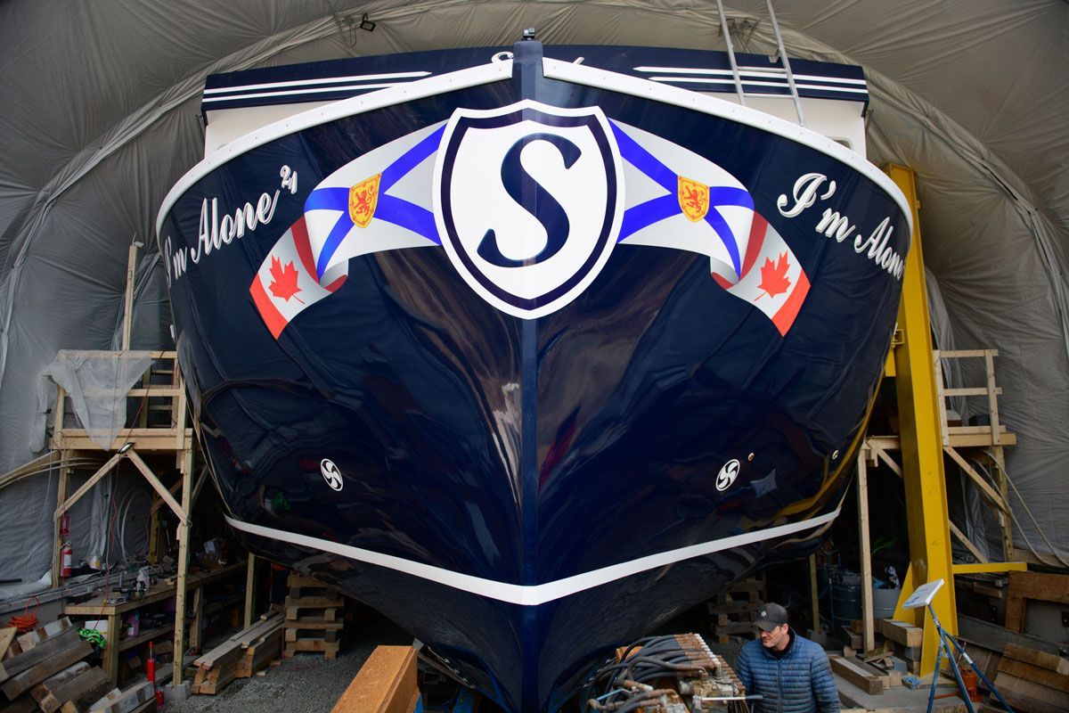 A large blue boat with the letter s on it