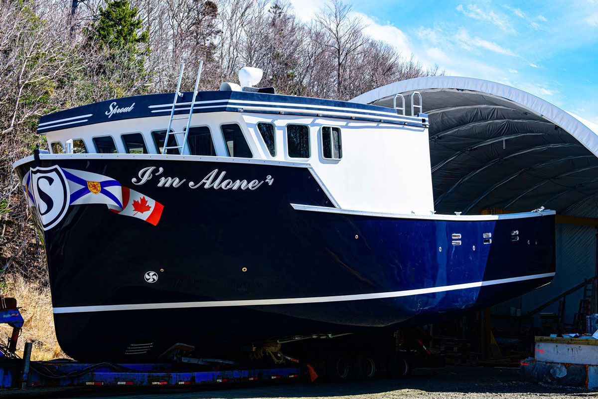 A boat with the name i 'm alone on it