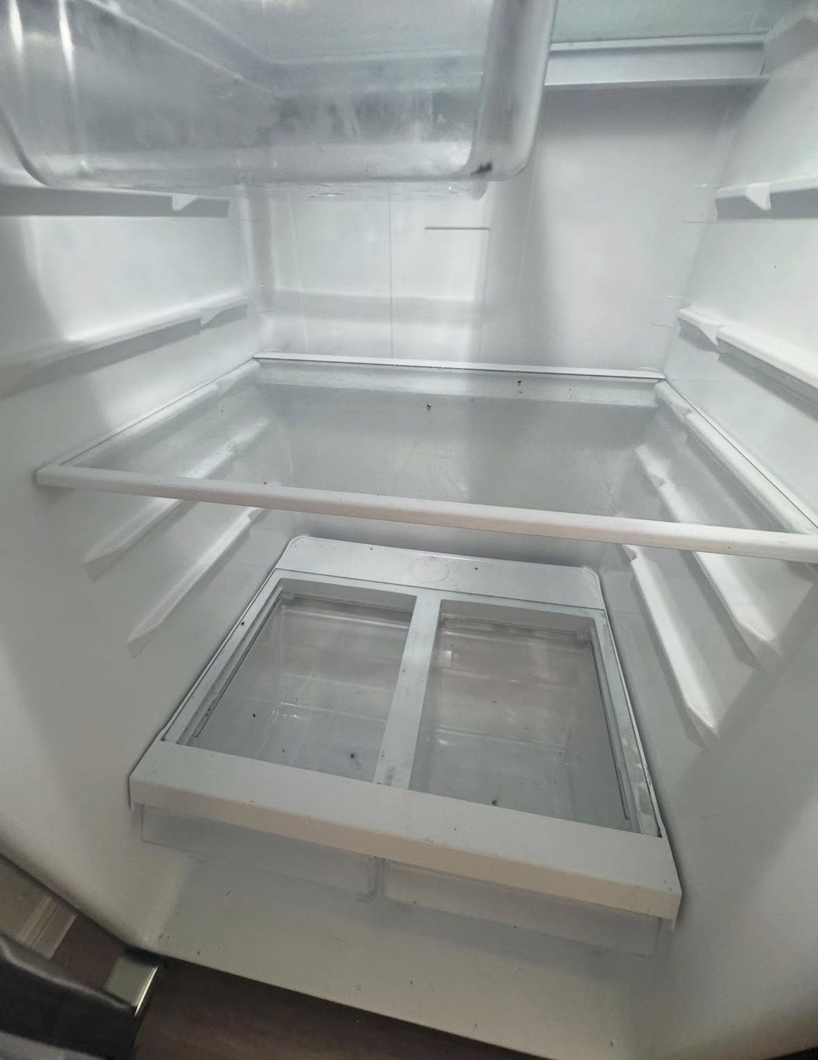 A messy dining room table with a vacuum cleaner on it.