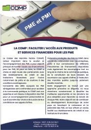 Un homme en cravate est assis devant un ordinateur portable.