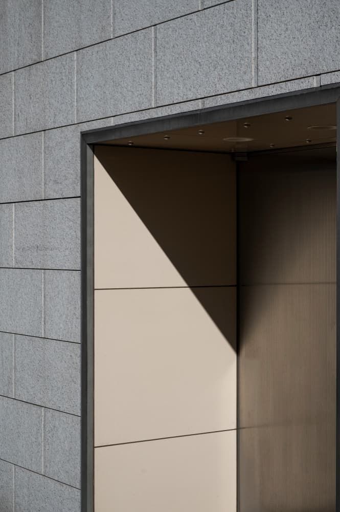 A close up of a door with a shadow on it