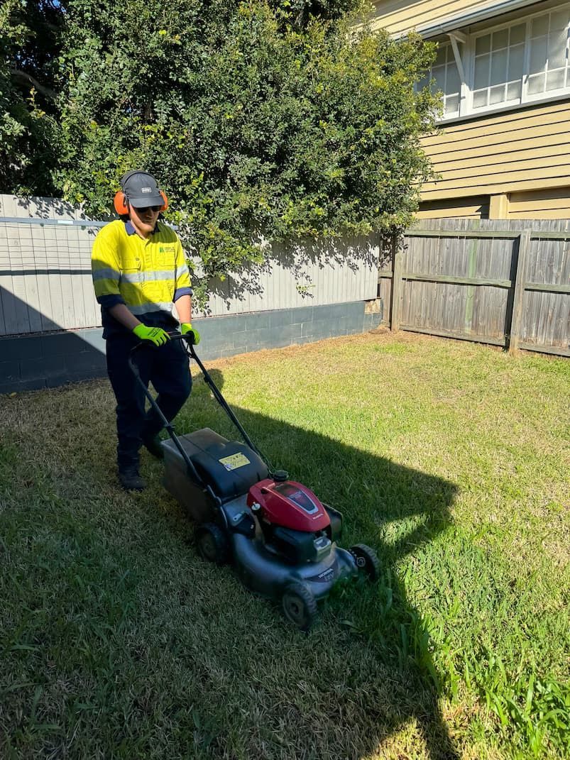 A person mowing a lawn