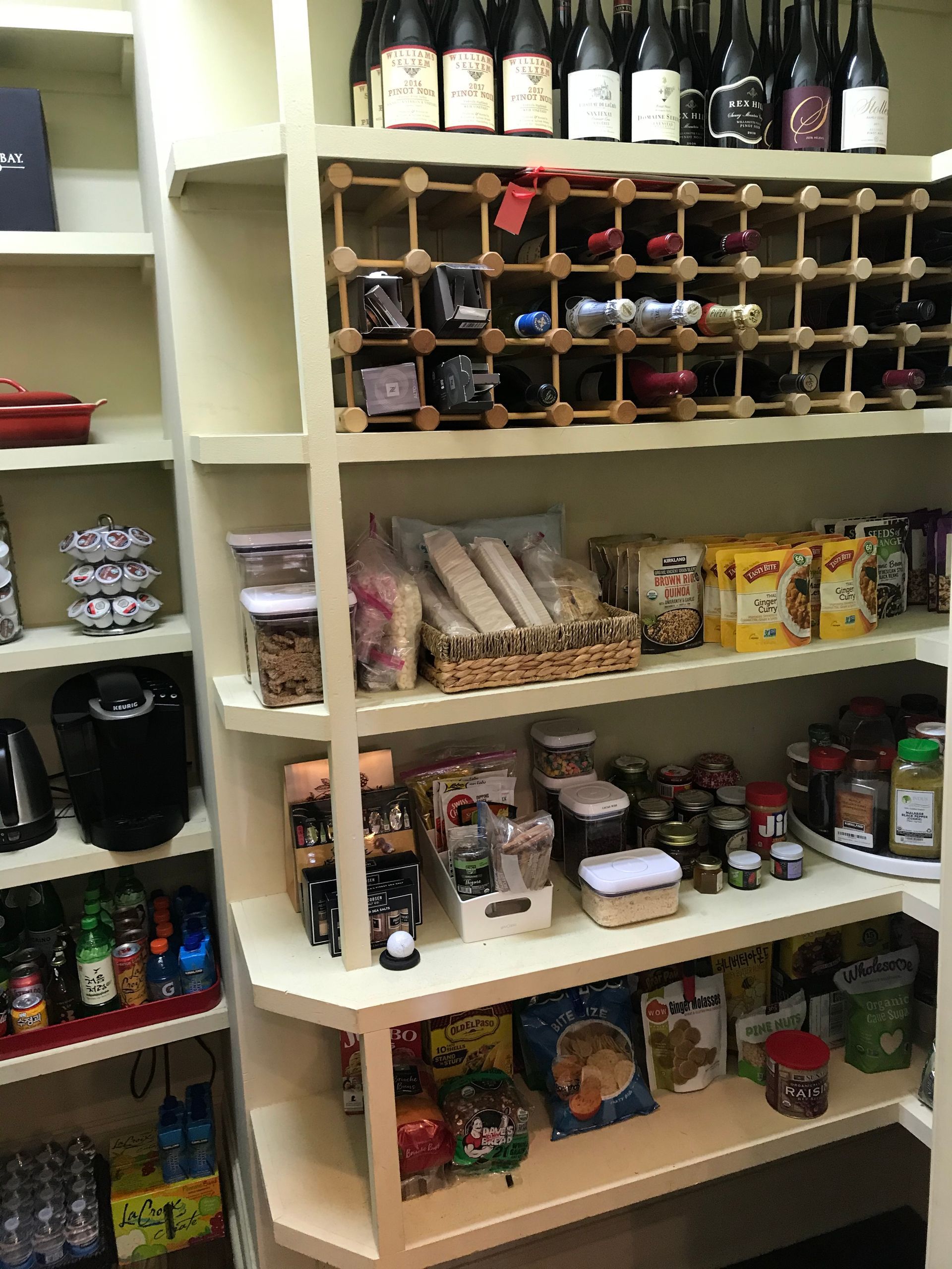 A pantry filled with lots of food and appliances.