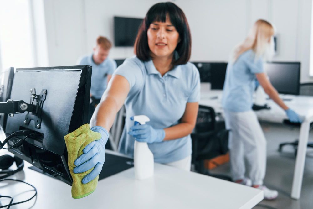Office cleaning team at work.