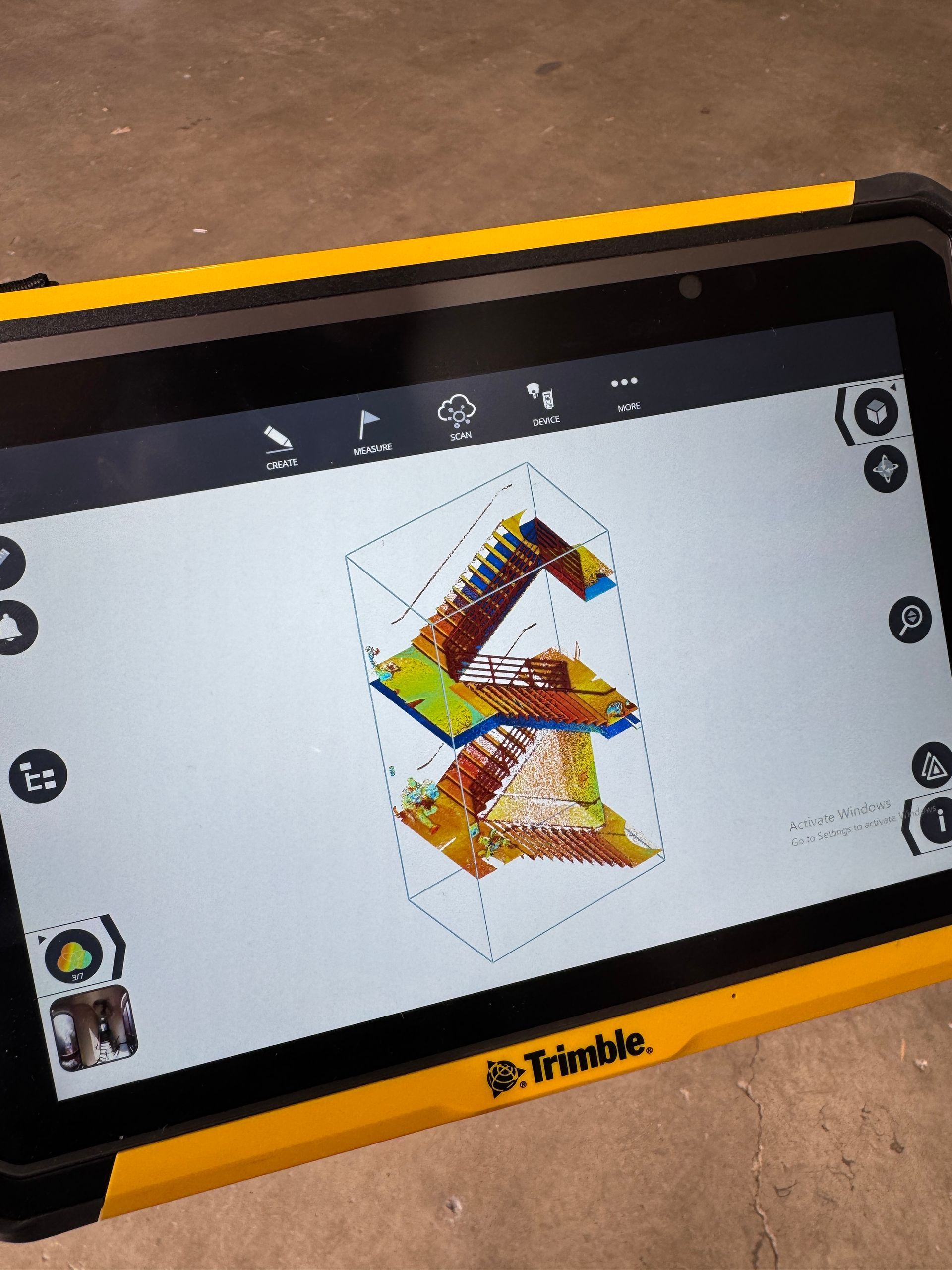 A tablet with a blueprint of a staircase on the screen.