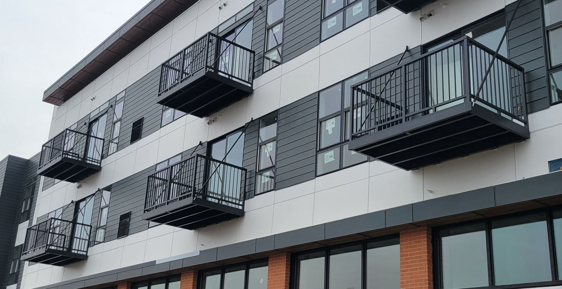 A large building with a lot of windows and balconies.