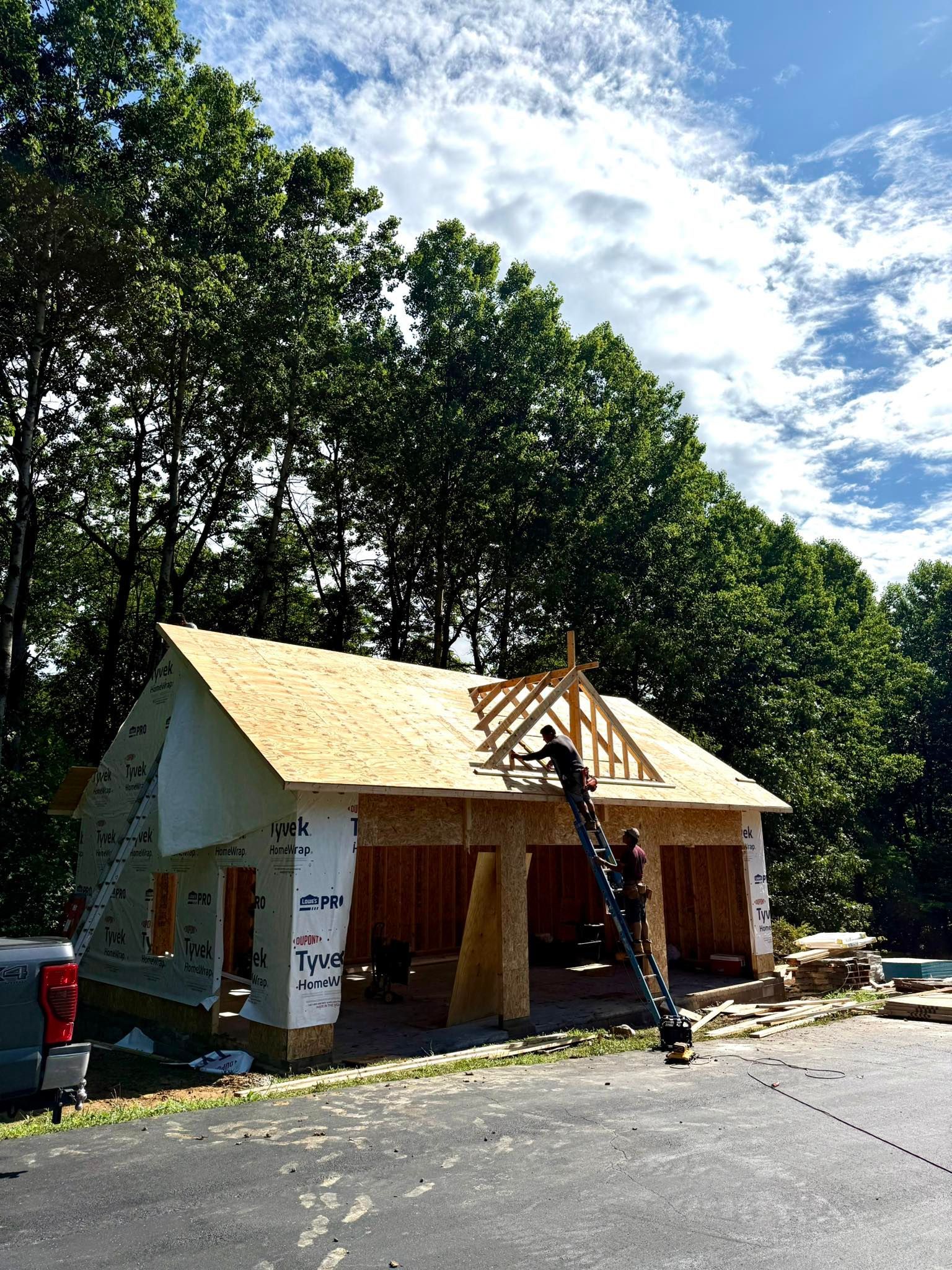 A house is being built in the middle of a forest.