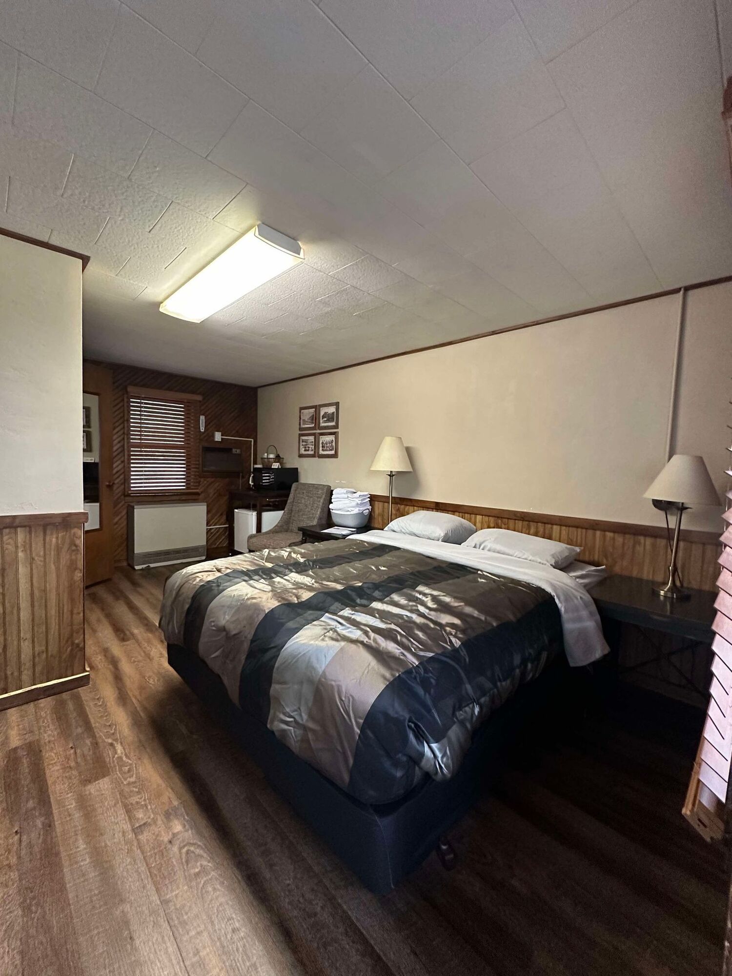 There is a large bed in the middle of the room.