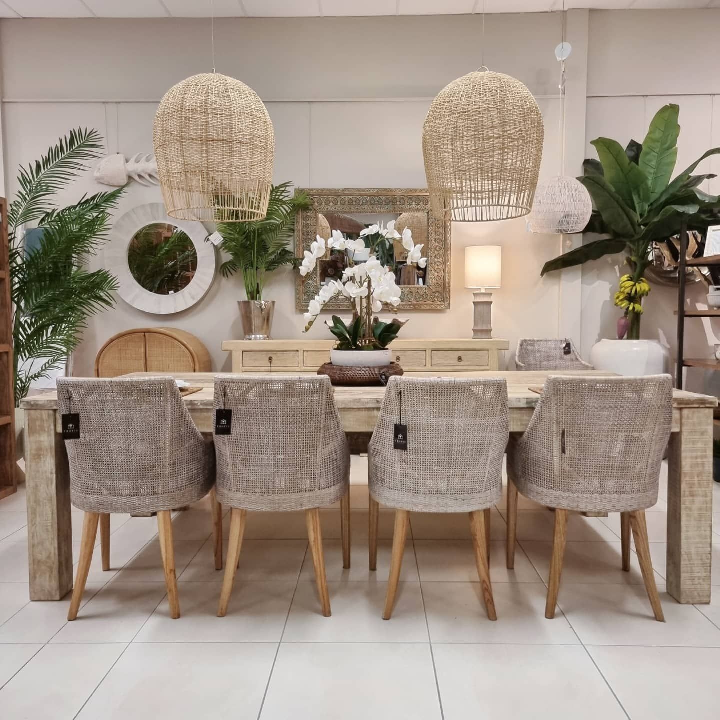 Dining Room with A Wooden Table, Woven Chairs, and Pendant Lights — Tropic Living in Palm Cove, QLD