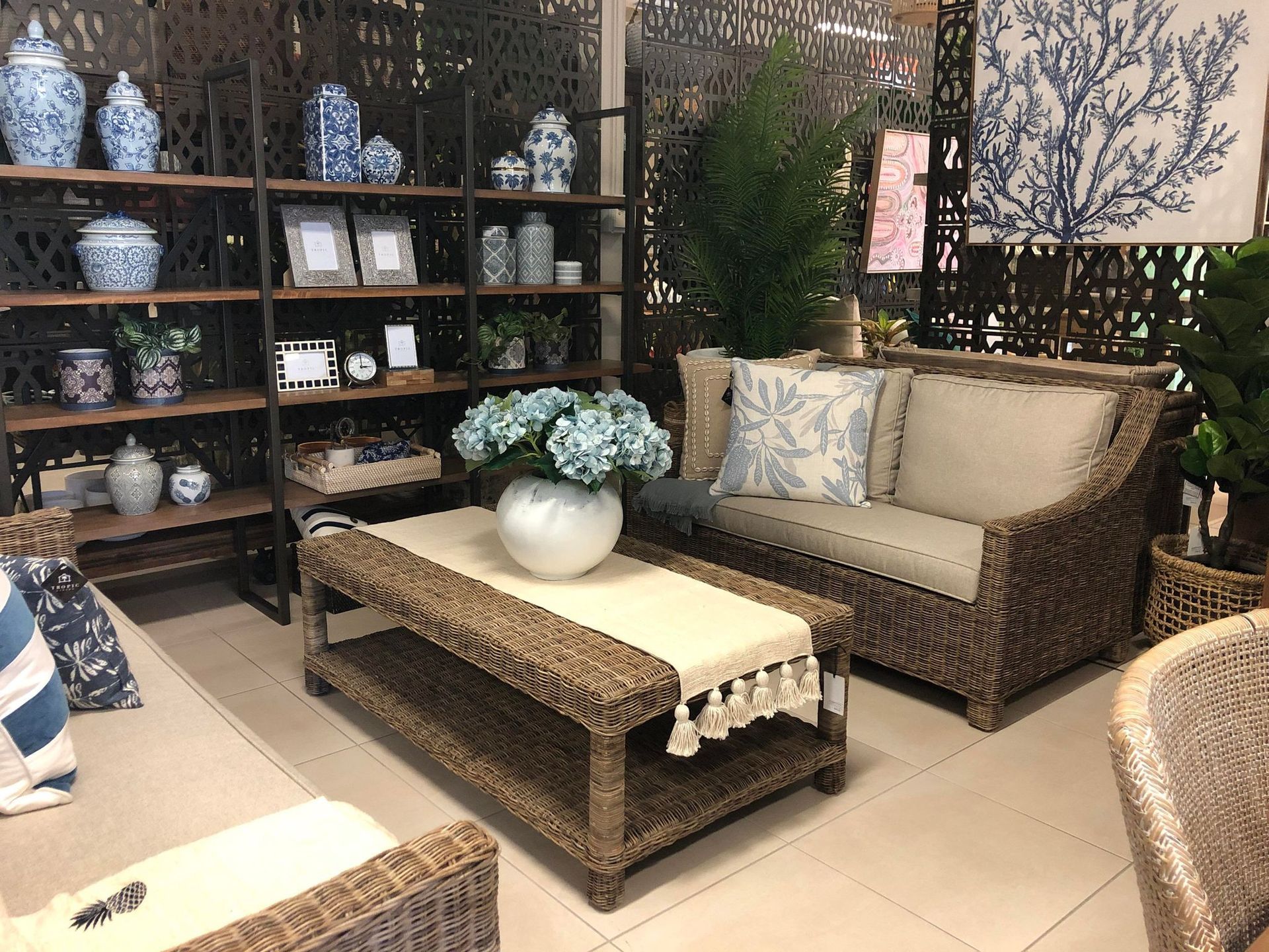 Living Room with Wicker Furniture, Blue-And-White Decor, and Shelf— Tropic Living in Mossman, QLD