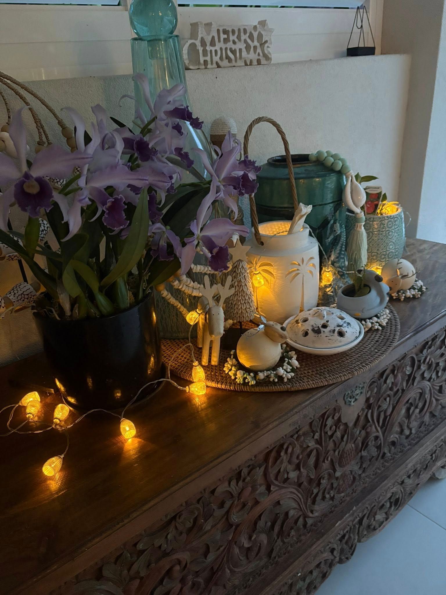 Christmas Floral Arrangement on Carved Wooden Chest, Lit with String Lights — Tropic Living in Clifton Beach, QLD