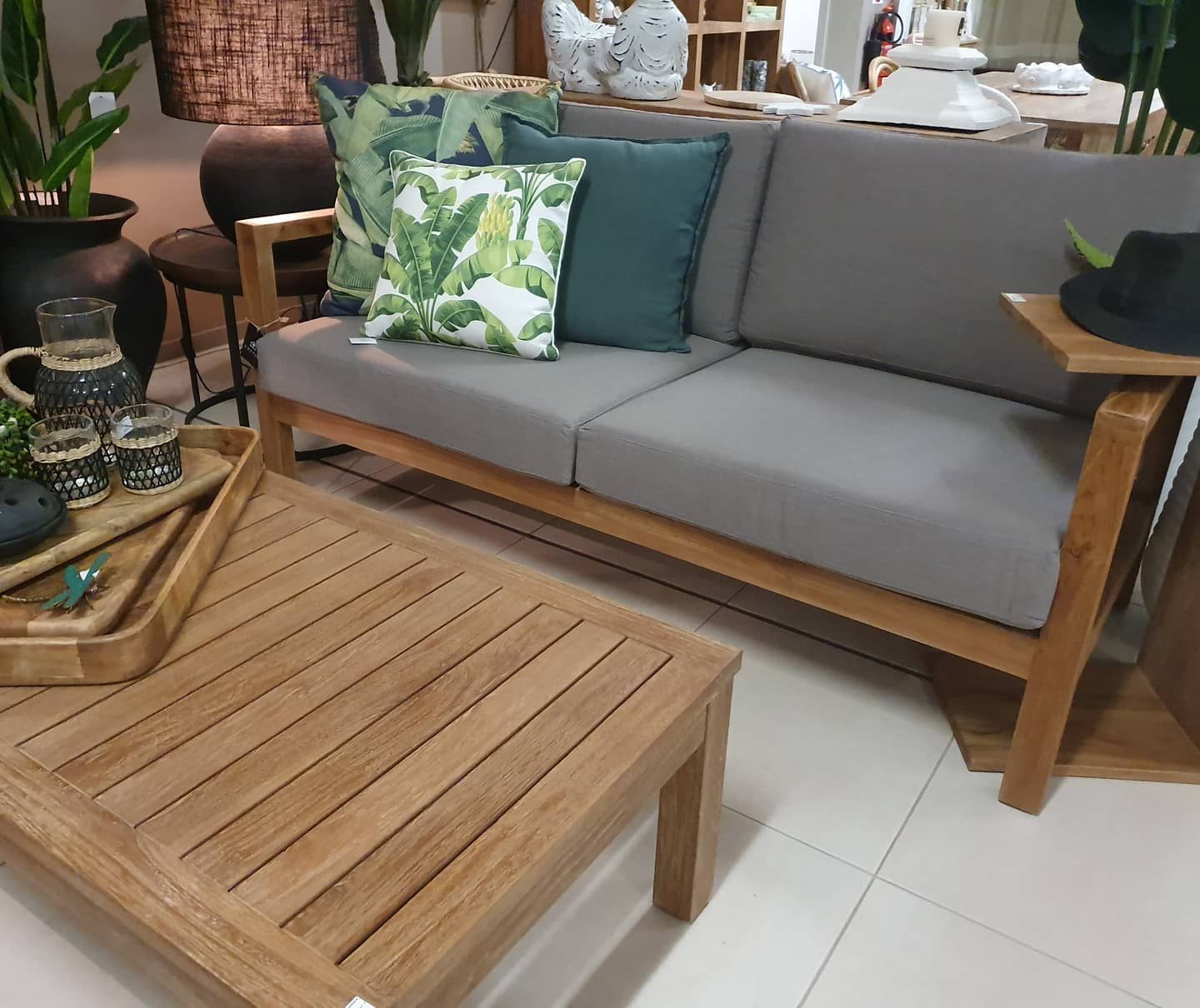 Wooden Outdoor Sofa with Gray Cushions and Coffee Table — Tropic Living in Smithfield, QLD