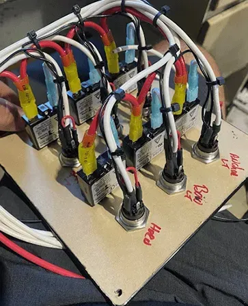 Circuit board with switches and wires, labeled
