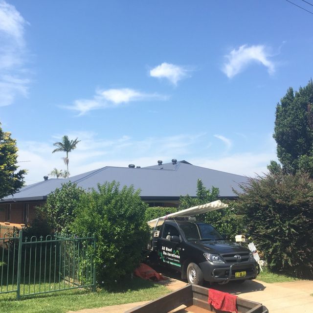 Company UTE Parked Next To The House — All Roof Restorations & Solar In Northern Rivers, NSW