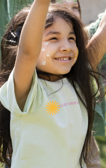 Smiling little girl with paint on her face - Mosaic Church, Freeport, FL